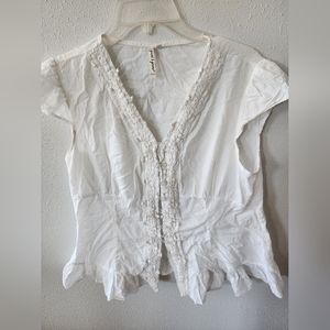 White 100% cotton lace trim and ruffled edge blouse.  Size L